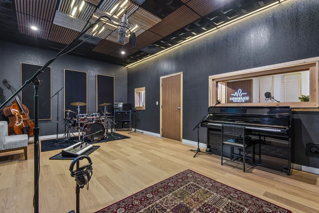 Recording studio acoustic solution with CNC engraved polyester panels