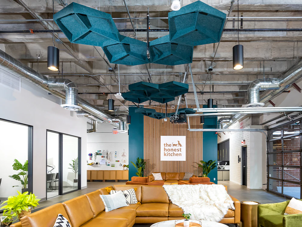 Modern open-plan office soundproofing with suspended PET acoustic baffles