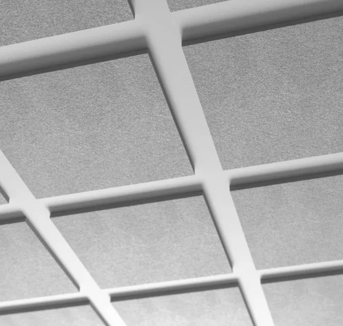 Modern open-plan office featuring geometric suspended PET acoustic clouds and vertical fabric baffles installed underneath an industrial exposed concrete ceiling.